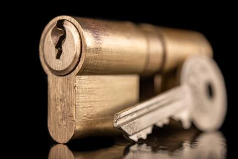 A solid lock and key for a household door. Accessory anti-burglary accessorie Stock Photos