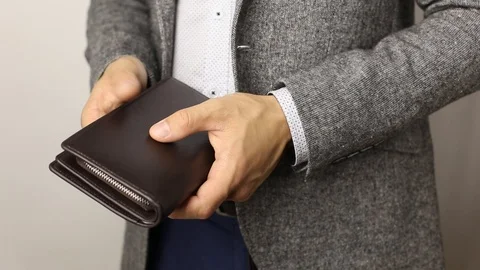 Solid man in gray jacket on white background takes three hundred US dollars Stock Footage 125128540