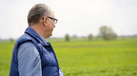 A solid man wearing glassses looking on a camera Stock Footage 63373963