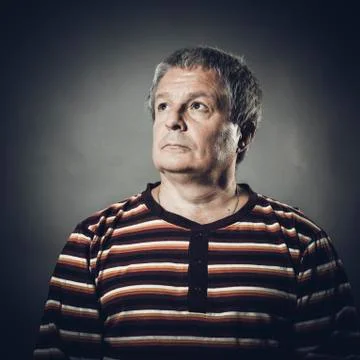 Solid middle aged man studio portrait on grey background. Stock Photos