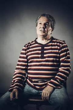 Solid middle aged man studio portrait on grey background. Stock Photos