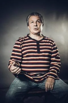 Solid middle aged man studio portrait on grey background. Stock Photos