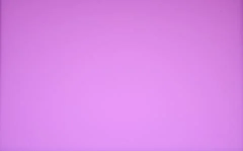 Solid monochrome bright purple background with vignetting down-left. 库存照片