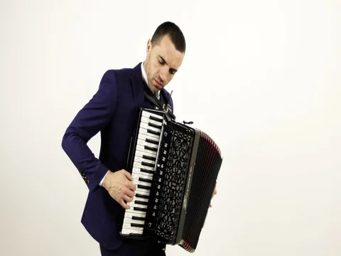 A solid musician plays the accordion in the studio. Stock Footage 75932860