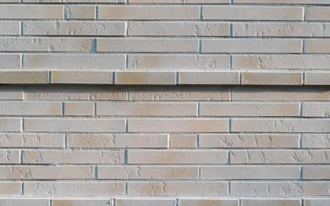 Solid new stone wall with a highlighted wall stripe Foto stock