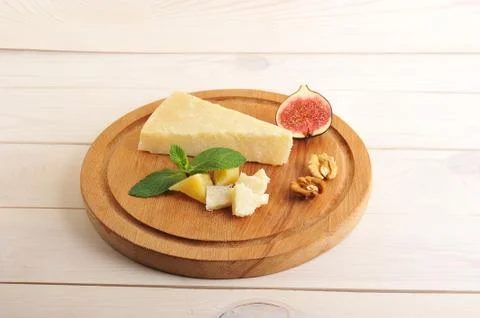 Solid Parmesan cheese, figs and walnuts, mint Stock Photos