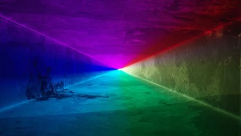 Solid rainbow laser light tunnel background - nightclub/music festival Stock Photos
