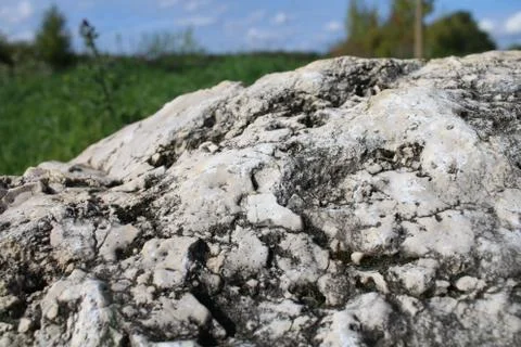 Solid rock on the field Stock Photos