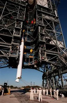 A solid rocket booster is lifted up the mobile launch tower at Pad 17A, Cap.. Stock Photos