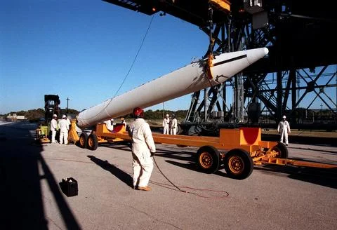 A solid rocket booster is lifted off a transport vehicle for its transfer t.. Stock Photos