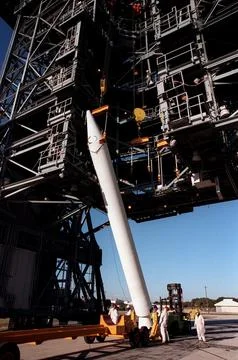A solid rocket booster is raised to a vertical position before lifting it u.. Stock Photos