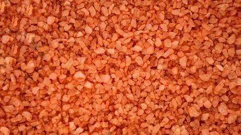 Solid sea bath salt background. Orange crystals of salt, beauty, health concept Stock Photos