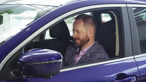 A solid seller sits in the car Stock Footage 80949554