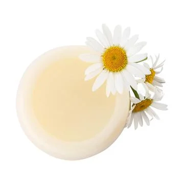 Solid shampoo bar and chamomiles on white background, top view. Hair care Stock Photos