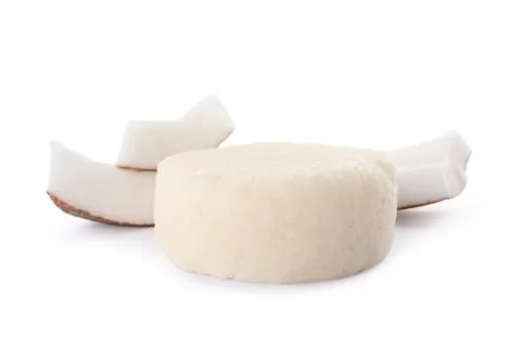 Solid shampoo bar and coconut pieces on white background. Hair care Foto stock