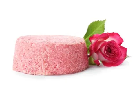 Solid shampoo bar and rose on white background. Hair care 写真素材