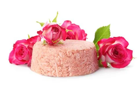 Solid shampoo bar and roses on white background. Hair care 写真素材