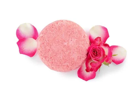 Solid shampoo bar and roses on white background, top view. Hair care 写真素材
