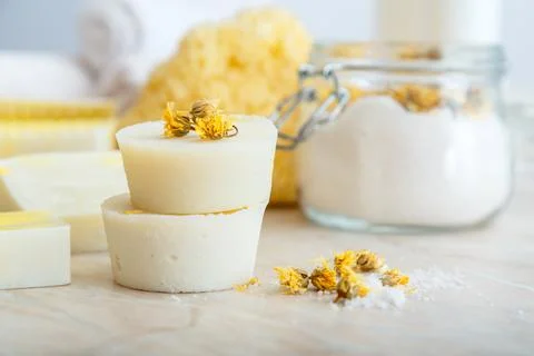 Solid shampoo bar many and handmade soap round bars with herbs dry marigold Stock Photos