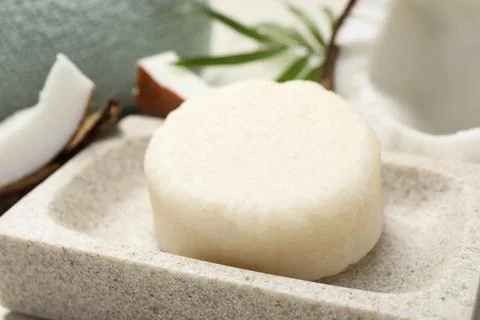 Solid shampoo bar in stone holder, closeup. Hair care 写真素材