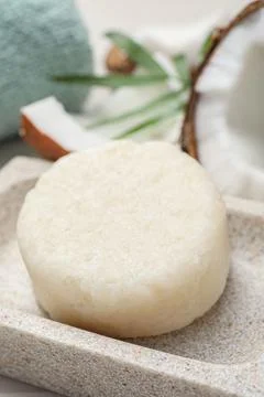 Solid shampoo bar in stone holder, closeup. Hair care Foto stock