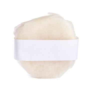 Solid shampoo bar wrapped in parchment isolated on white Stock Photos