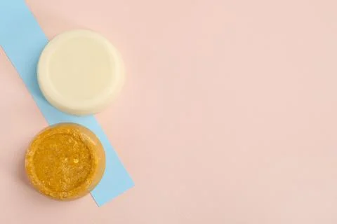 Solid shampoo bars on color background, flat lay. Space for text Stock Photos
