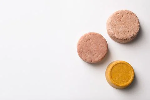 Solid shampoo bars on white background, flat lay. Space for text 写真素材