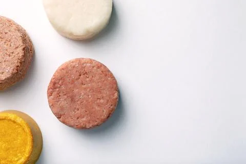 Solid shampoo bars on white background, flat lay. Space for text 写真素材