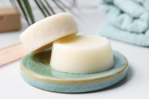 Solid shampoo bars on white table, closeup. Hair care 写真素材