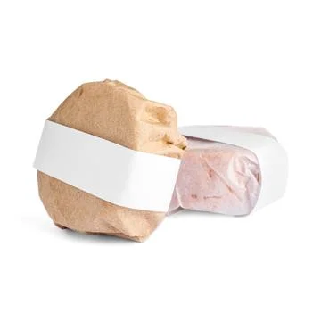 Solid shampoo bars wrapped in parchment on white background Stock Photos