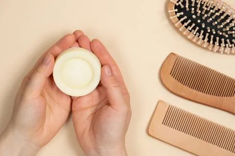 Solid shampoo in female hands. Natural eco-cosmetics without plastic for the 写真素材