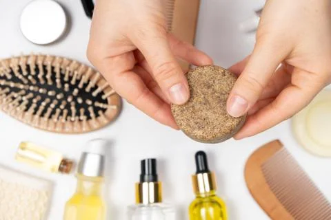 Solid shampoo in female hands. Natural eco-cosmetics without plastic for the Stock Photos