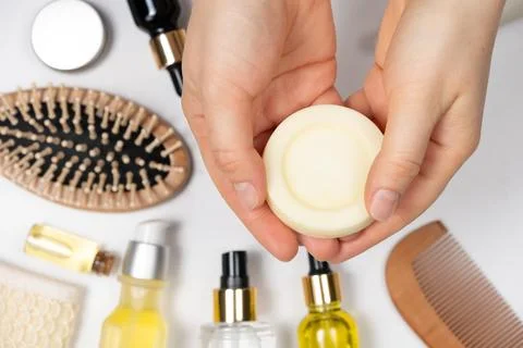 Solid shampoo in female hands. Natural eco-cosmetics without plastic for the 写真素材