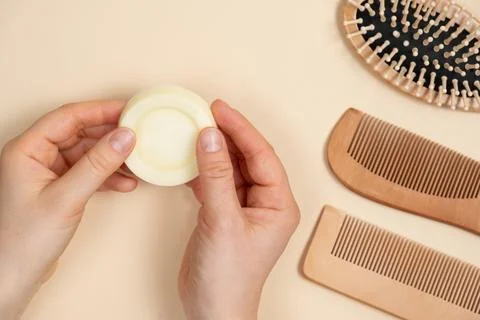 Solid shampoo in female hands. Natural eco-cosmetics without plastic for the 写真素材