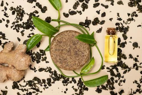 Solid shampoo with green tea and ginger. Natural hair cosmetics made from herbs Photos