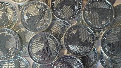 Solid silver English Britannia coins rotate in front of camera Stock Footage 245501479