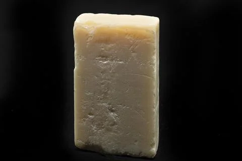 Solid soap bar stands against dark backdrop 写真素材
