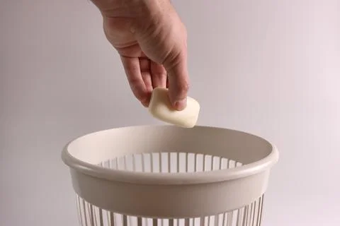 Solid soap is thrown into the trash for recycling Stock Photos