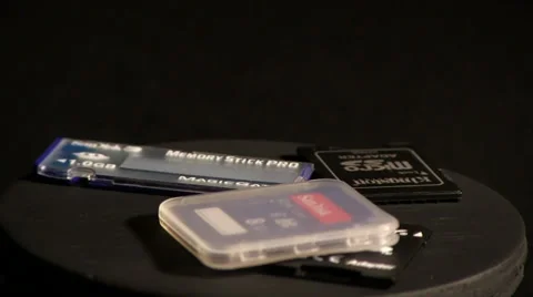 Solid state media rotating against black background Video stock 32659691