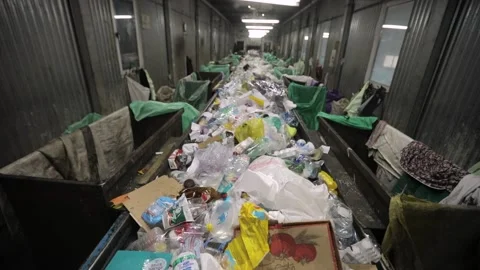 Solid waste in containers. Heaps of various unsorted trash, plastic, cellophane Stock Footage 156028826
