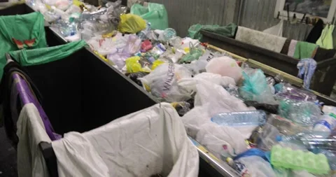 Solid waste in containers. Heaps of various unsorted trash, plastic, cellophane Stock Footage 156047438