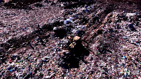 Solid waste disposal and landfill gas collection. Dozer on Garbage dump Stock Footage 212075128