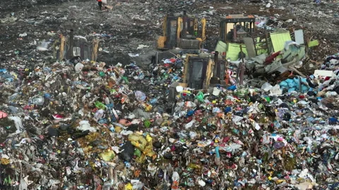 Solid waste disposal on landfill. Landfill with solid household waste. Video stock 218454082