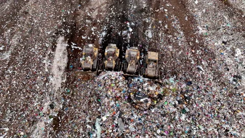 Solid waste disposal on landfill. Landfill with solid household waste. Video stock 218454750