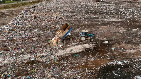 Solid waste disposal on landfill. Landfill with solid household waste. Stockbeeldmateriaal 218458296