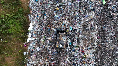 Solid waste disposal on landfill. Landfill with solid household waste. Video stock 218496446