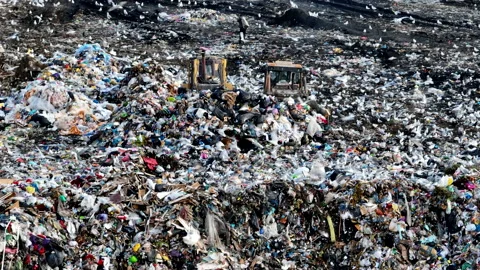 Solid waste disposal on landfill. Landfill with solid household waste. Video stock 218505283