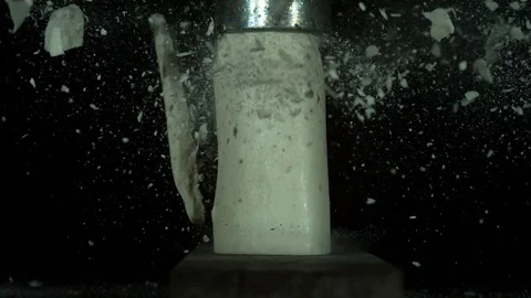 Solid White Cylinder Shatters Under Pressure Stock Footage 77783323
