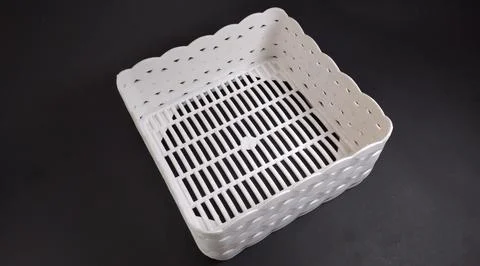 Solid white Plastic Storage Box in square shape, with woven texture, black .. Stock Photos